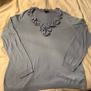 1x blue sweeter with ruffles around next